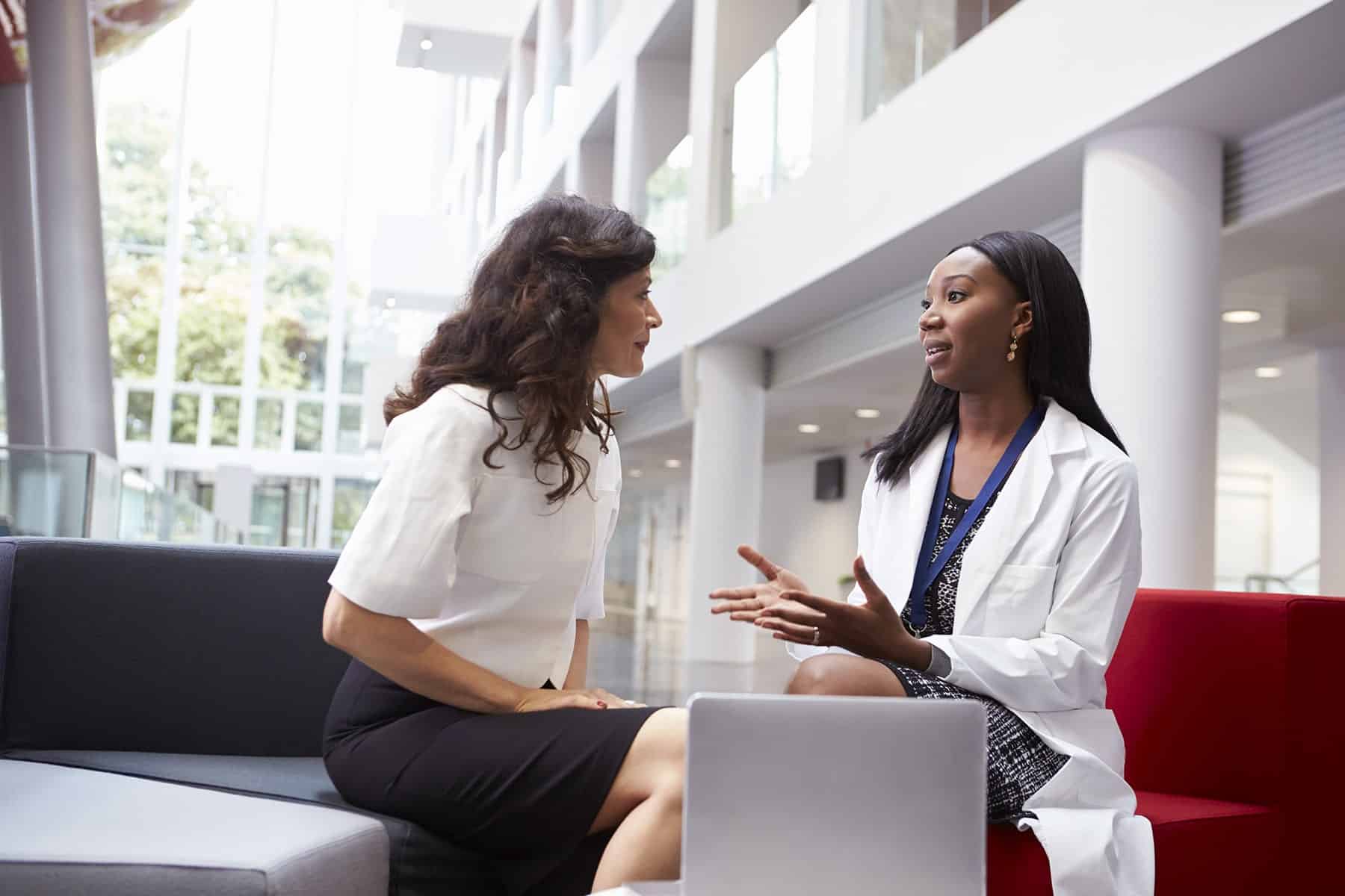 Female-Colleagues-Discussing-2021-05 Female Colleagues Discussing